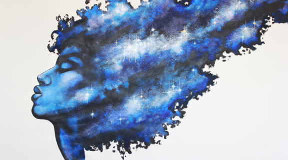 womans profile with outer space