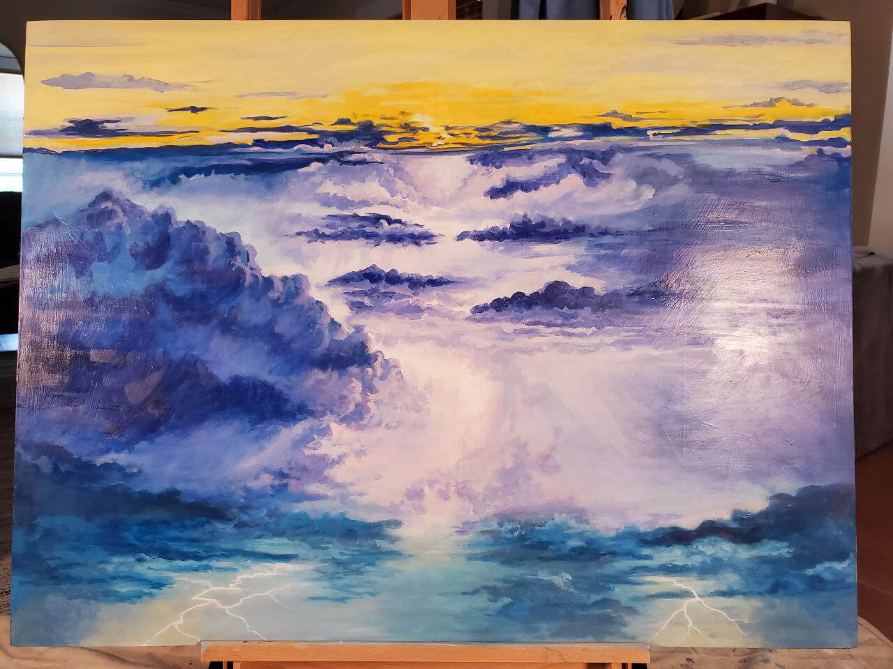 A work in progress detail from the Lighting Dance painting of a transparent golden Ganesha dancing in a turbulent sky with lighting emanating from the tip of his helmet.