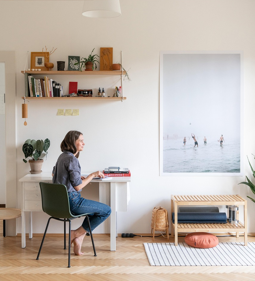 A woman sitting at her desk in her home office